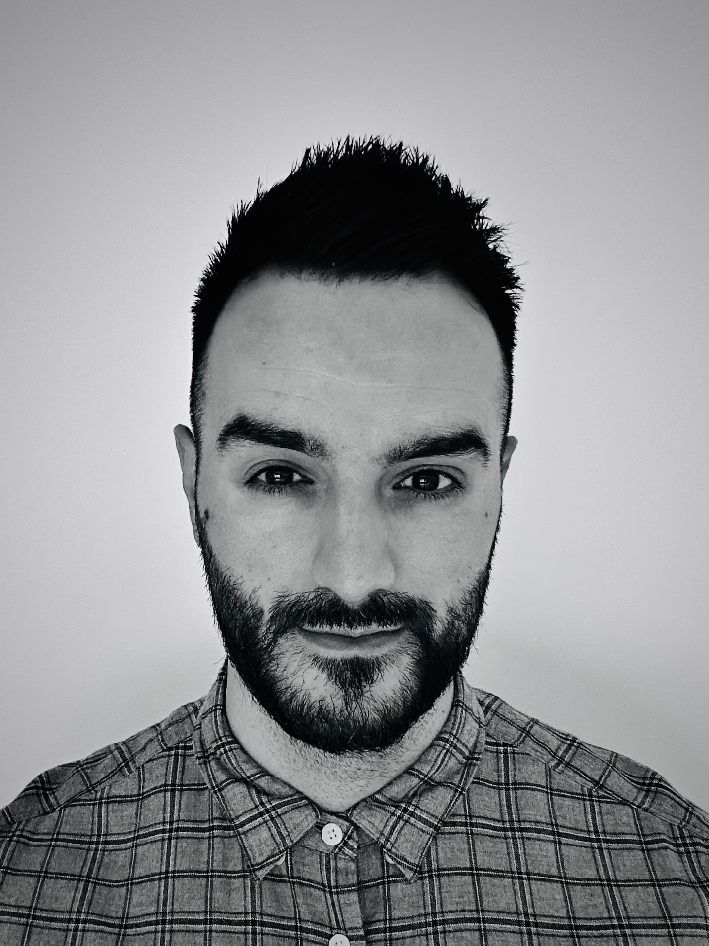 Black and white headshot of Liam, founder of Your Remote Tech Recruiter
